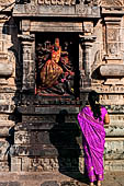 The great Chola temples of Tamil Nadu - The Nataraja temple of Chidambaram. Image of Durga in combat inserted into a niche of the wall near the East Gopura.